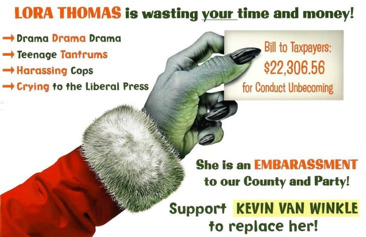 Douglas County Commissioner Lora Thomas filed a complaint on Jan. 9 because the postcards do not include a paid-for-by disclaimer, which is typically required under campaign finance laws.